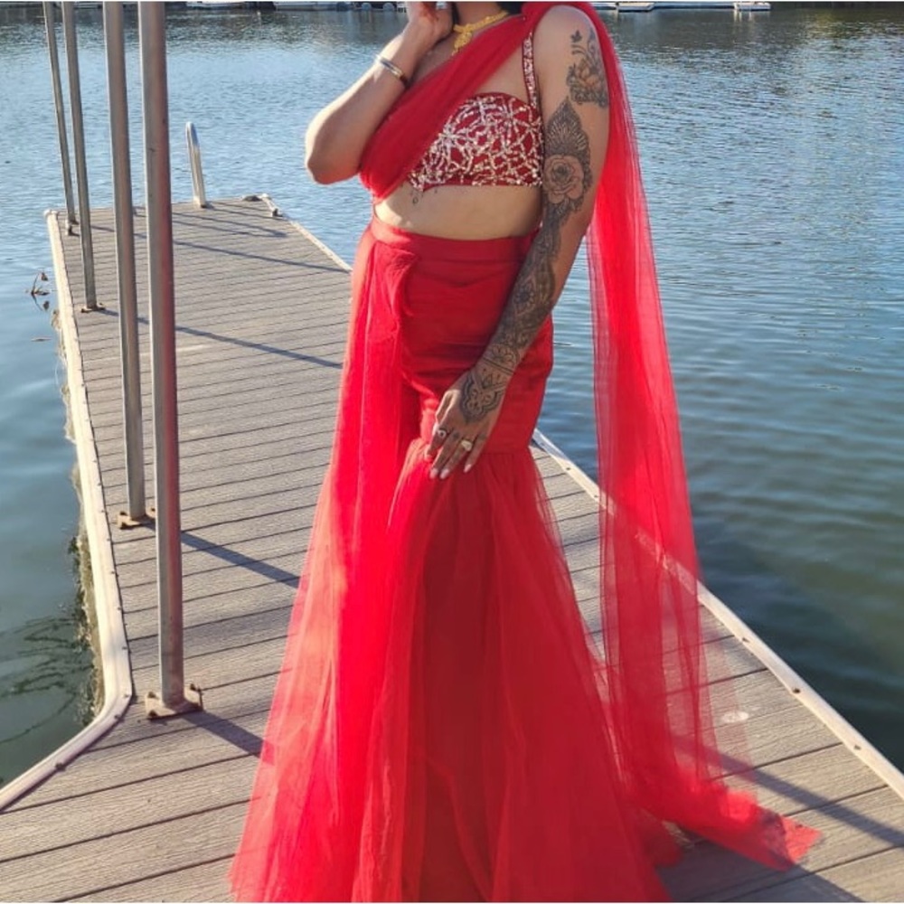 Designer sharara saree. In perfect condition . Comes with matching bag a…